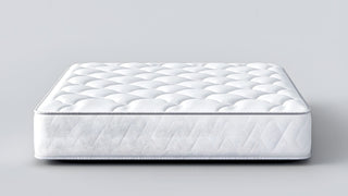 White quilted mattress with textured pattern on a plain background