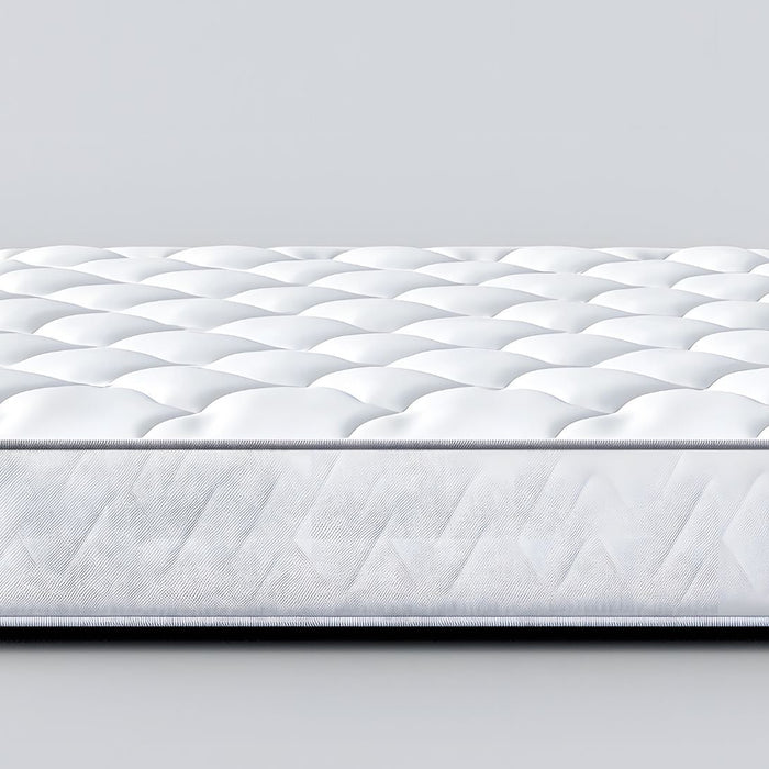 White quilted mattress with textured pattern on a plain background