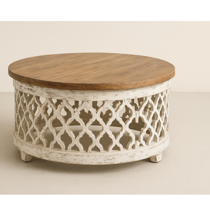 Round wooden coffee table with carved white lattice base and natural wood top