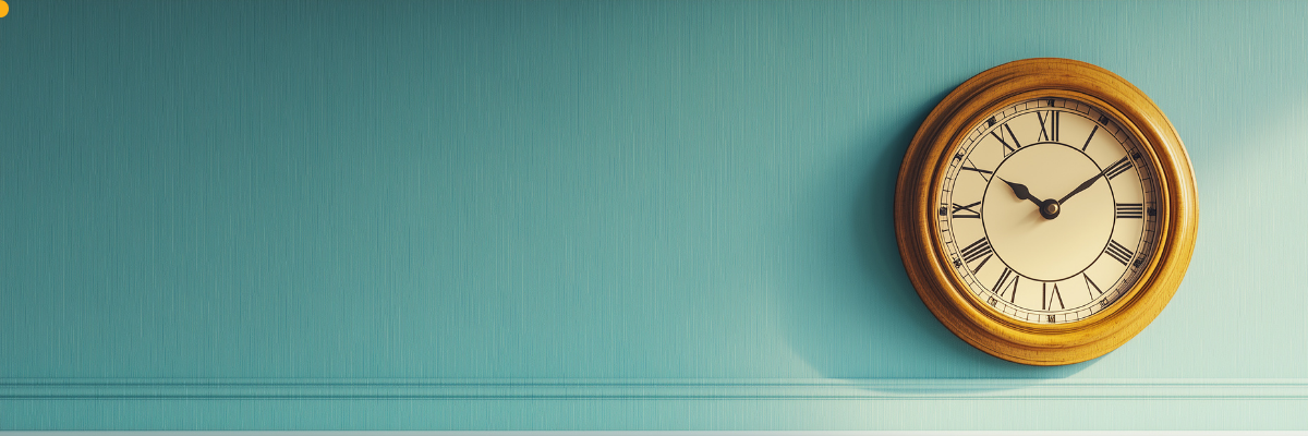 Vintage wooden wall clock with Roman numerals on teal wall, home decor