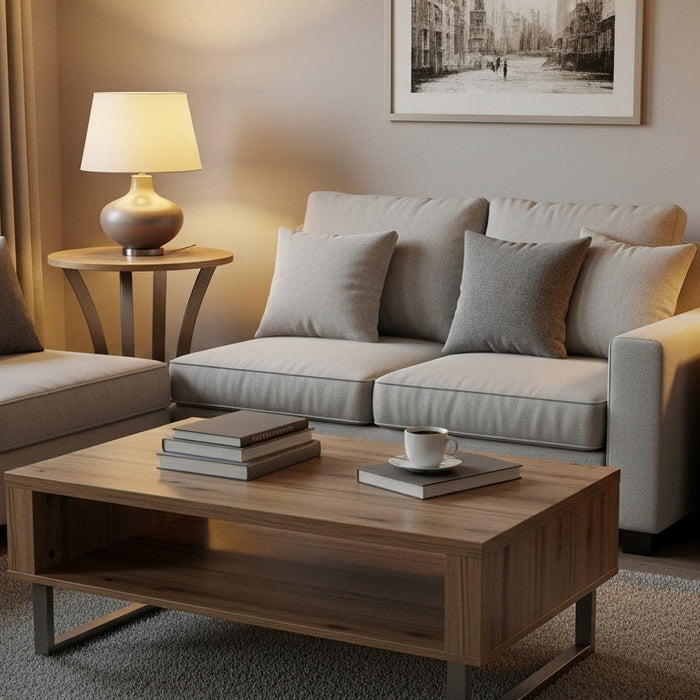 Modern living room with grey sofas, wooden coffee table, table lamps, and neutral decor