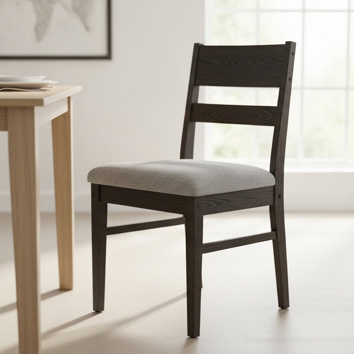 Tapered-leg dining chairs in a compact Pyrmont apartment, demonstrating the visual floor rule for 2026 small-space living
