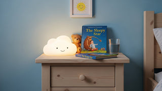 Cloud night light, children's book, teddy bear, and glass of water on kids' nightstand