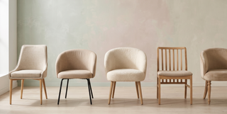 Range of beige dining chairs in different styles on a pastel backdrop.