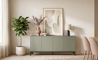 Modern buffet cabinet styled with art and a vase in a calm, elegant dining room.