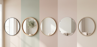 Range of round mirrors in different frames on a calm pastel wall.