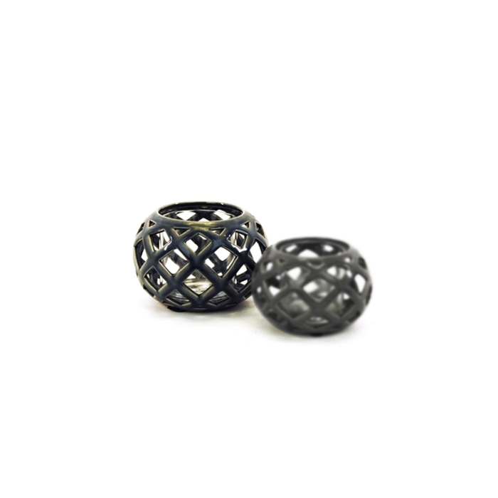 Charcoal Ethereal Lace Candle Holder casting intricate shadows, enhancing the room's ambience