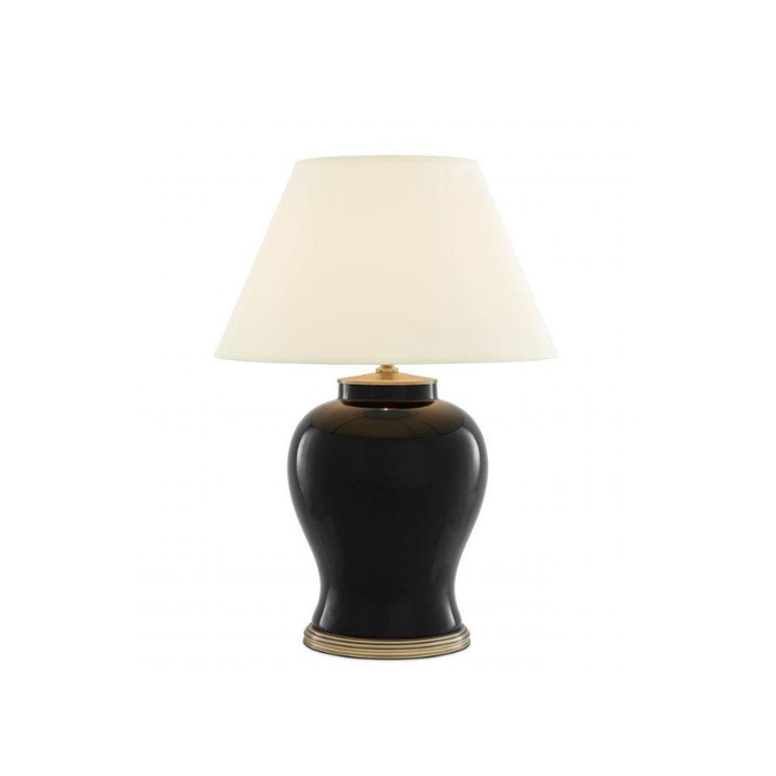 Sophisticated ceramic table lamp with brass accents, perfect for contemporary home decor.