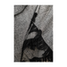 Close-up of the plush fabric and tassel edge of the sophisticated throw