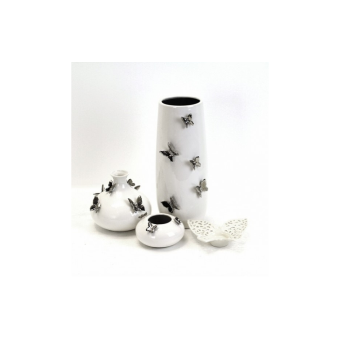 Intricate Butterfly Candle Holder casting playful shadows in a dimly lit room