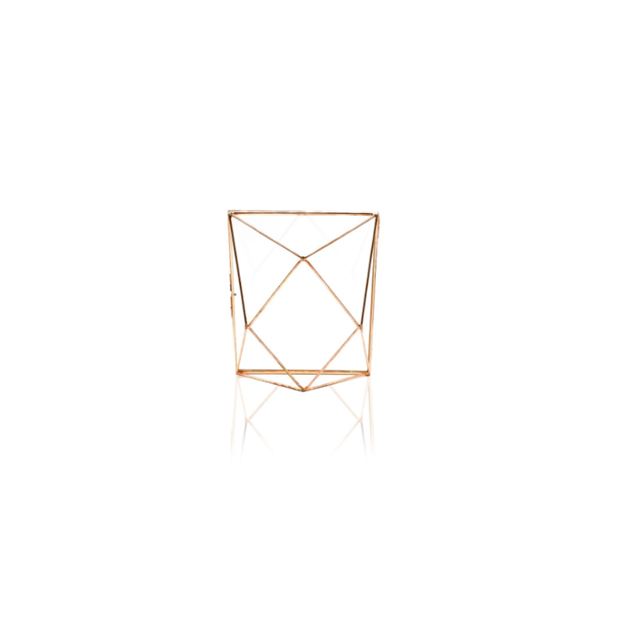 Sleek and sophisticated rose gold photo frame on a cozy bedside table.