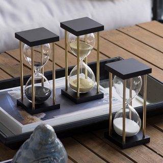 A trio of hourglasses featuring tan, azure, and blush sands - a symphony of time in multiple hues.