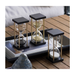 A trio of hourglasses featuring tan, azure, and blush sands - a symphony of time in multiple hues.