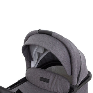 Modern grey baby stroller bassinet with canopy and padded sides for comfort