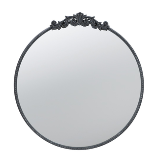 Round wall mirror with black ornate decorative frame and vintage design