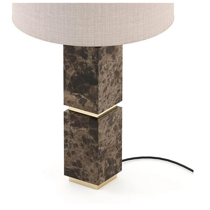 Close-up of marble base with gold accent between sections.