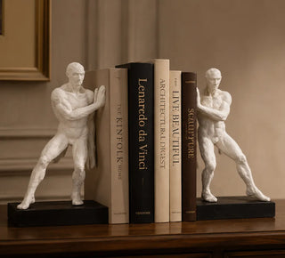 Athletic Figure Bookend Set holding books on a study shelf