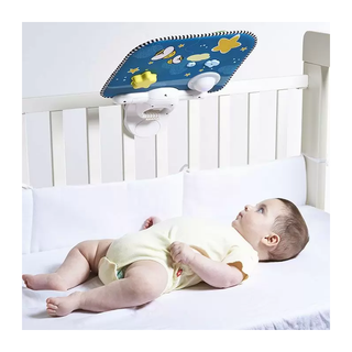 Baby lying in crib watching Tiny Love Double Sided Cot Baby Toy