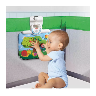 Baby playing with colorful interactive Tiny Love Double Sided Cot Baby Toy
