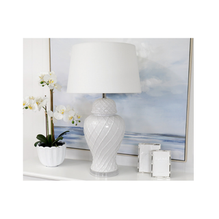 Elegant Bay Water Lamp styled with orchids – luxury Hamptons lighting décor.
