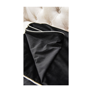 Black Double Sided with White Pipping Throw Close-up on Sofa