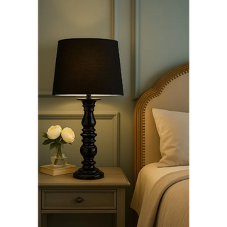 Black Resin Stick Lamp on Bedside Table