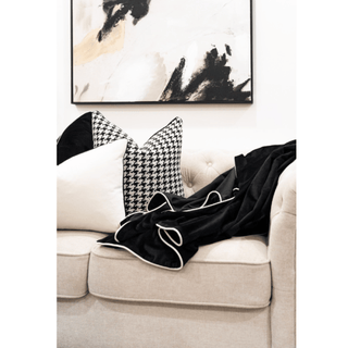 Black Velvet Throw Blanket with White Piping on Sofa