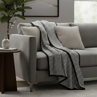 Black and White Houndstooth Throw with Black Border On Sofa