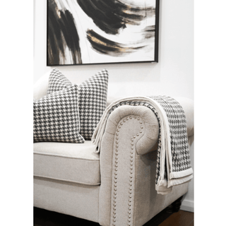 Black and White Houndstooth Throw with White Trim on Sofa