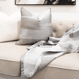 Brushed Artistic Grey Shades Throw Close-up on Sofa