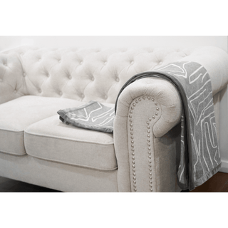 Brushed Bark Throw with Satin Border On Sofa Arm Rest