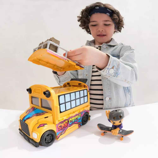 Child playing with yellow SK8 Crew toy bus and skateboard figure on white table