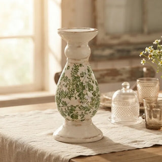 Cream Floral Ceramic Candlestick styled on a linen-draped dining table with vintage glassware and fresh flowers