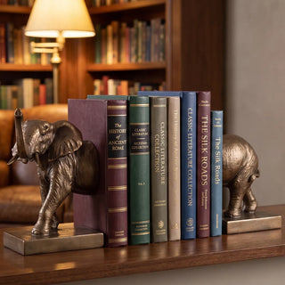 Elephant Bookend Set holding books on a study shelf