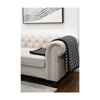 White and Black Galloping Grace Horse Pattern Throw thrown over a sofa
