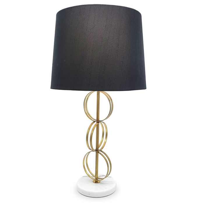 Gold Circles Lamp with black shade and brass rings, front view.
