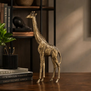 Golden Giraffe Ornament On Wooden Desk