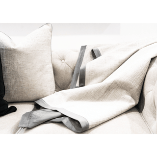 Grey Contrast Throw with Textured Reverse on Sofa