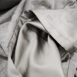 Grey Mist Throw with Satin Trim Close-up under