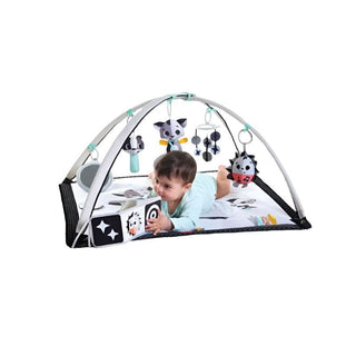 Kid Playing With the Developmental Book of Tiny Love Black & White Magical Tales Gymini 