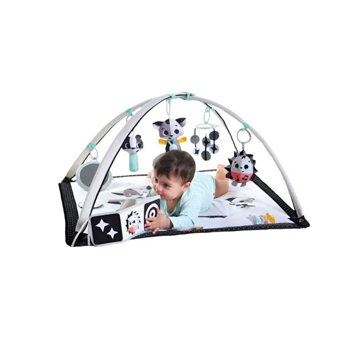Kid Playing With the Developmental Book of Tiny Love Black & White Magical Tales Gymini 