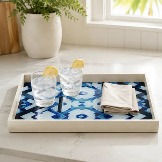 Kitchen bench scene with the blue and white geometric tray holding two glasses of iced water.