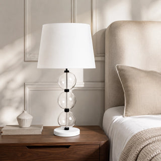 Marina Sand Glass Lamp On Bedside Table In a Moern Bedroom