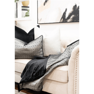 Metallic Grey and Black Throw Blanket with Black Trim On Sofa