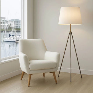 Tripod floor lamp in a room as a feature completing an elegant interior