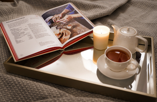 Rectangular Plain Silver Serving Tray being used with tea, candles and books