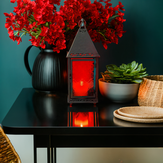 Red Square Morocco Lantern With Rustic Look Lit With Red Flowers
