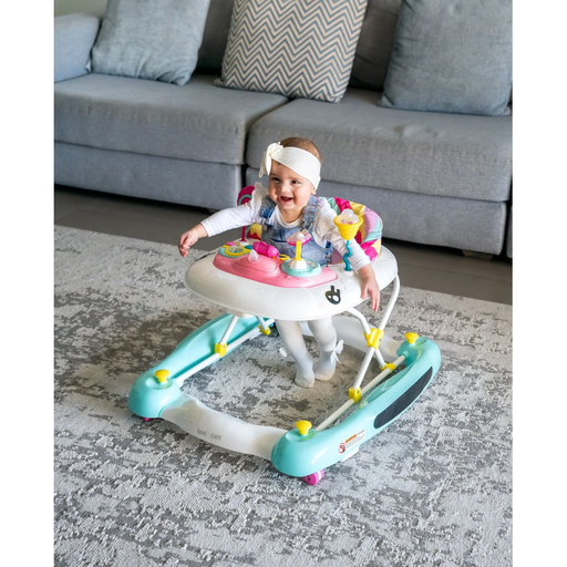 Smiling baby in Love N Care Toddler Unicorn Walker Rocker