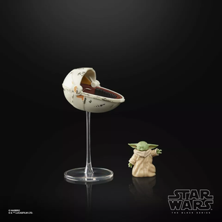 Star Wars The Black Series Grogu action figure with floating pod display on black background