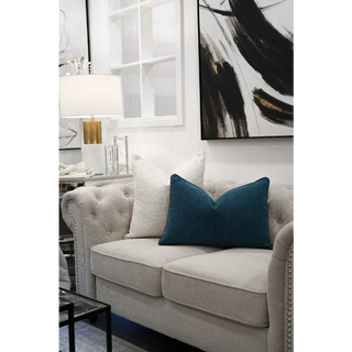 Teal Woven Cushion On Sofa With White Cushion